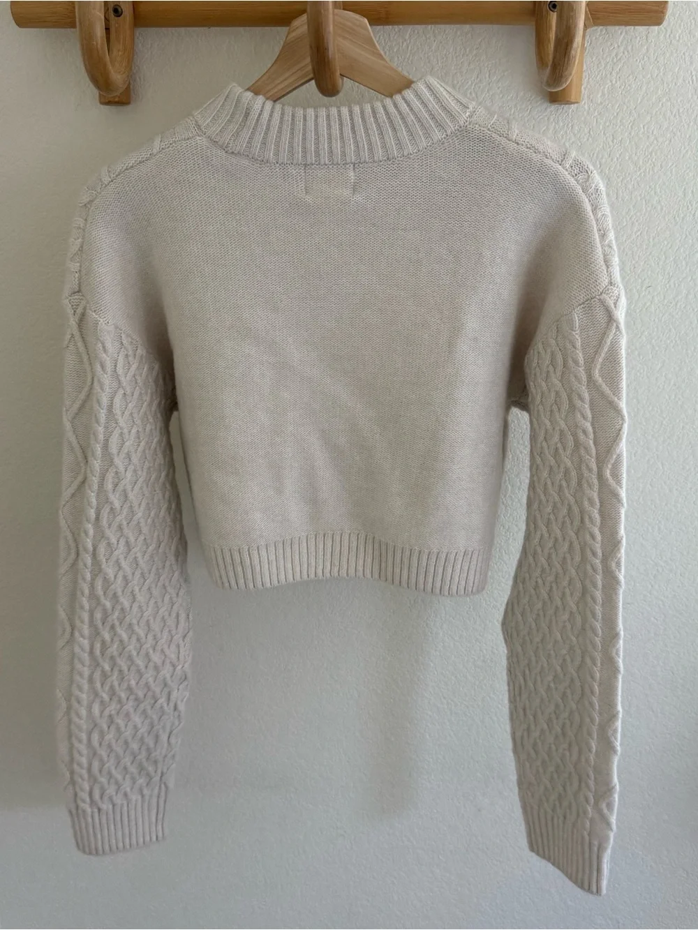 Clean girl capsule wardrobe minimalist preppy cream cable knit cropped sweater